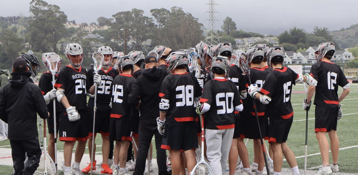 The team huddles during halftime to discuss game plan going into second quarter 
