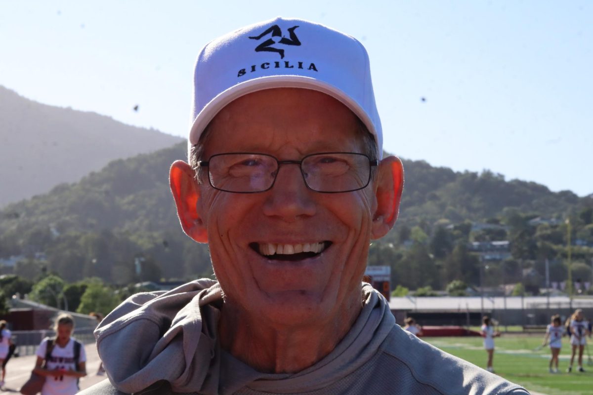 Downing smiles at the camera during Track practice