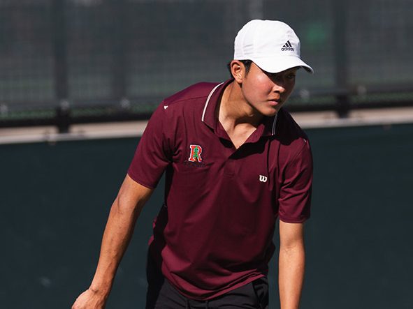 Julian Zhang serving in his #1 Doubles match against University. (Photo courtesy of University Tennis)