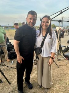 Julia Cherner stands with President Volodymyr Zelenskyy after interviewing him for what became their Emmy-nominated production.
