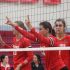 Holding up her fingers, senior Kate Sicklick signals to her teammate where to serve the ball.