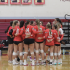 The Giants gather during a timeout, excited about their lead in the set.