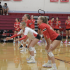 Sophomore Ella Moran gets low and ready to pass the serve coming over the net.