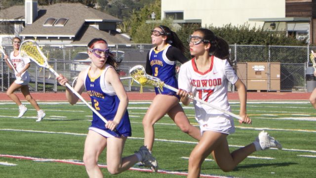 Charging towards the goal, sophomore Nina Baker outruns a Terra Linda player.