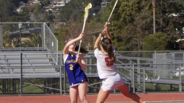 Crushing the tipoff, freshman Phoebe Miller gets the ball to the Giants.