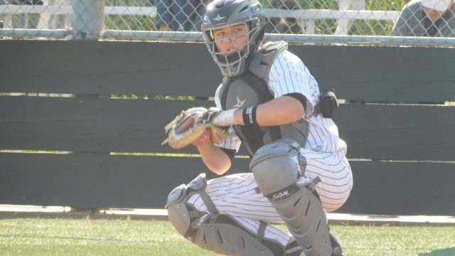 Sophomore catcher Ethan Ferry warms up with Rex Solle prior to the inning.