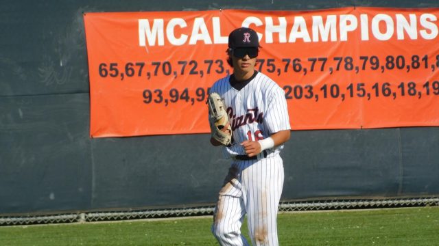 Shifting prior to the at-bat, TJ Beck covers the outfield.