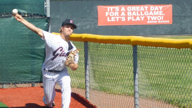 Senior Rex Solle fires in a fastball preparing for the game.