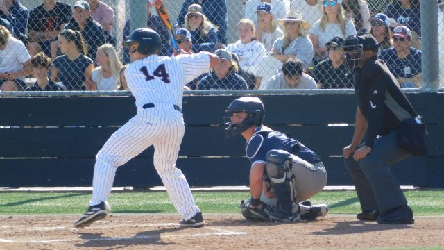 Junior Matthew Knauer prepares to take a pitch from Marin Catholic’s Liam Smith.